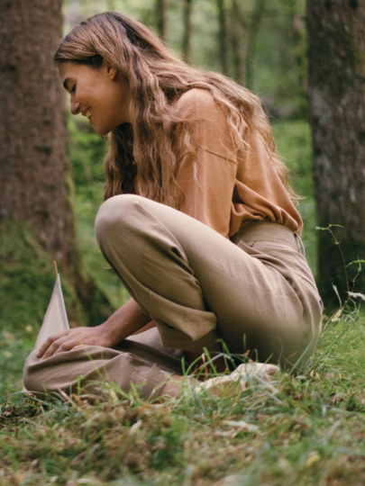 woman sitting in the forest with the child